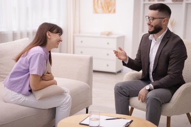 Photo of Professional psychologist working with patient in office