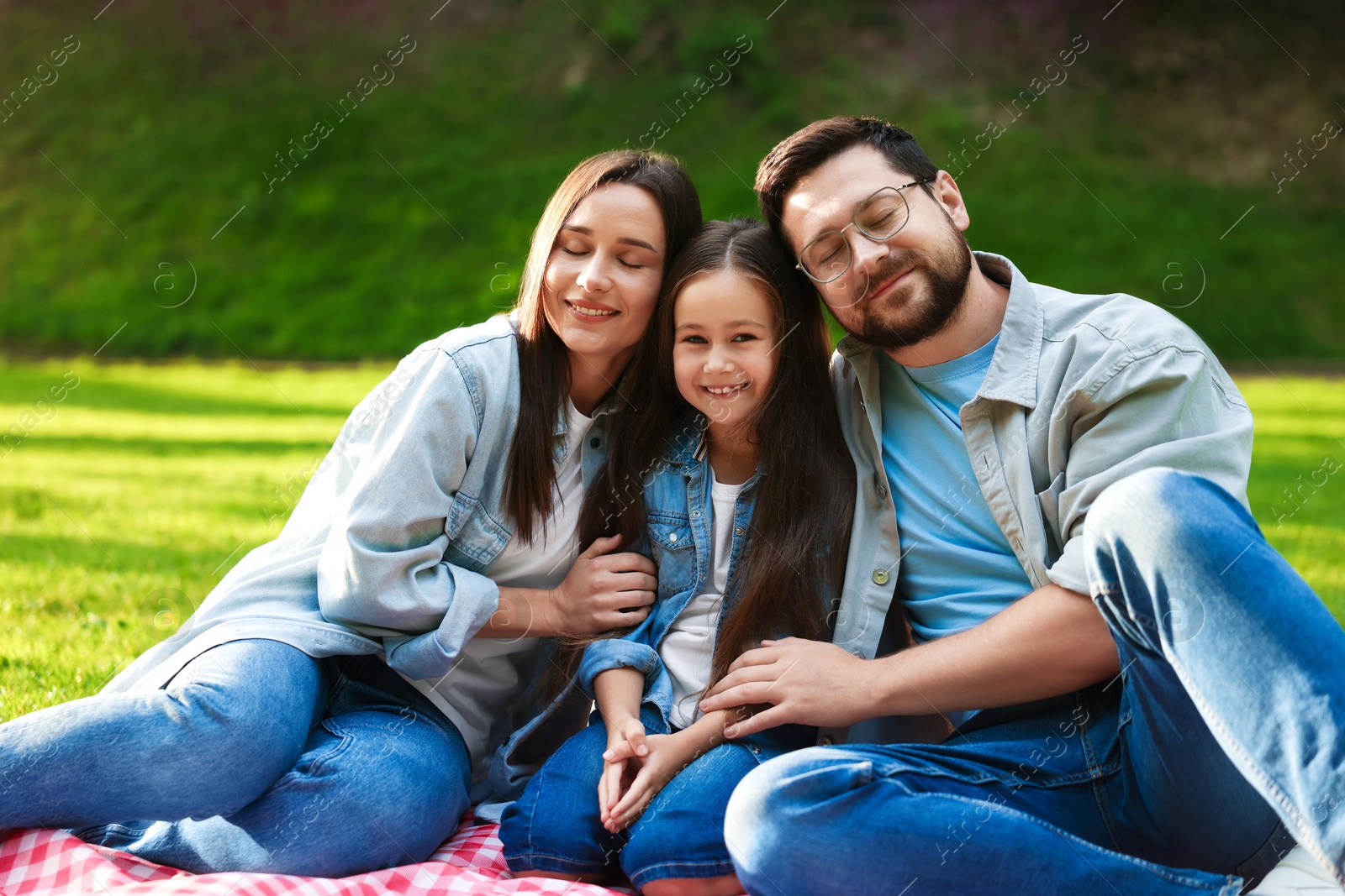 Happy family spending time together in park Photo of Happy family spending time together in park