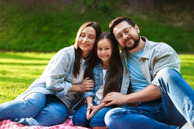 Photo of Happy family spending time together in park