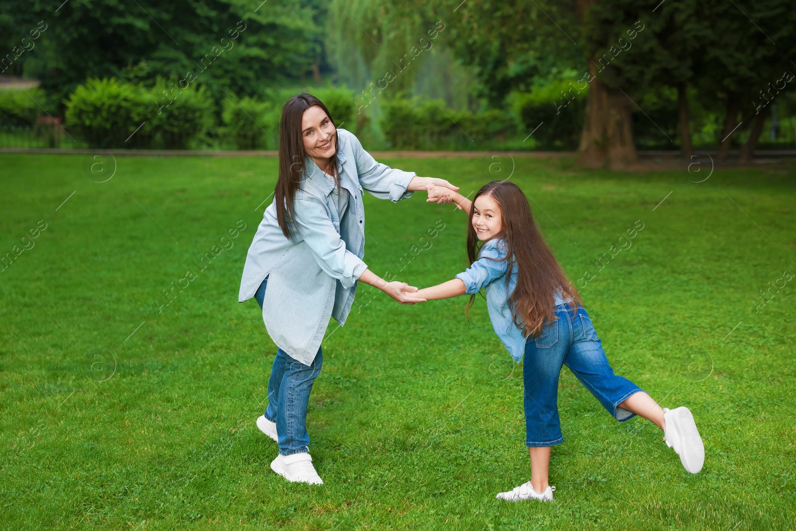 Family getaway. Happy mother and daughter spending time together in park Photo of Family getaway. Happy mother and daughter spending time together in park