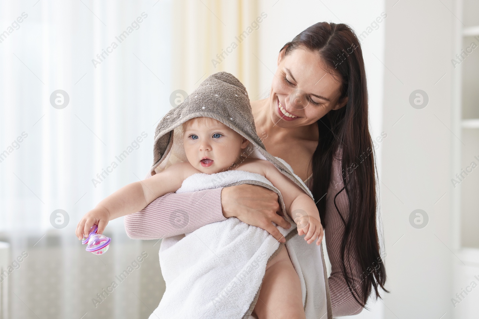 Mother with her cute baby at home Photo of Mother with her cute baby at home