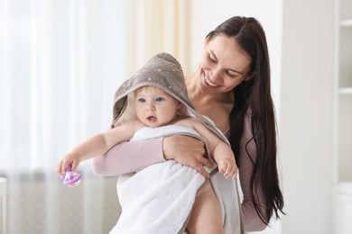 Photo of Mother with her cute baby at home