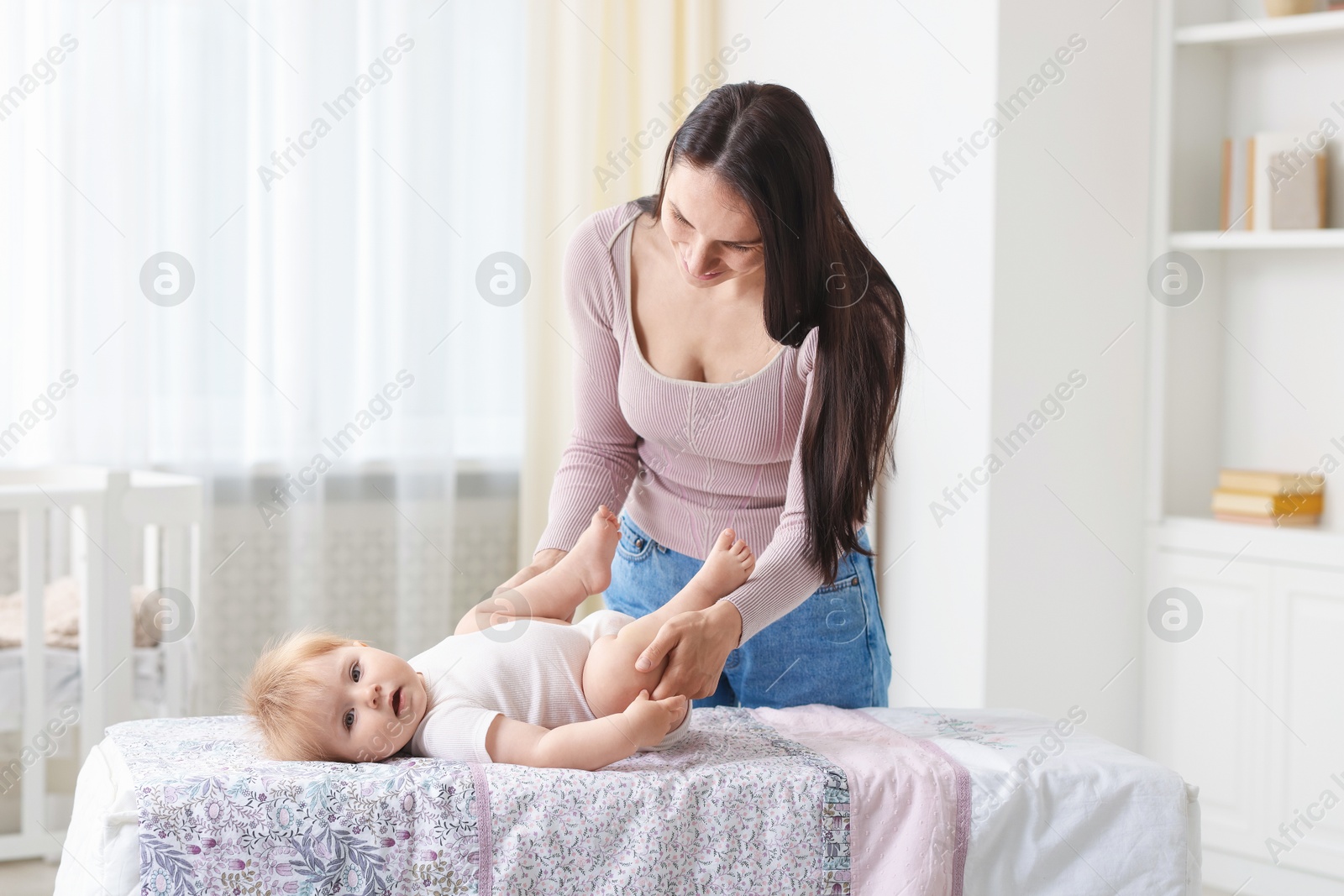 Mother with her cute baby at home Photo of Mother with her cute baby at home