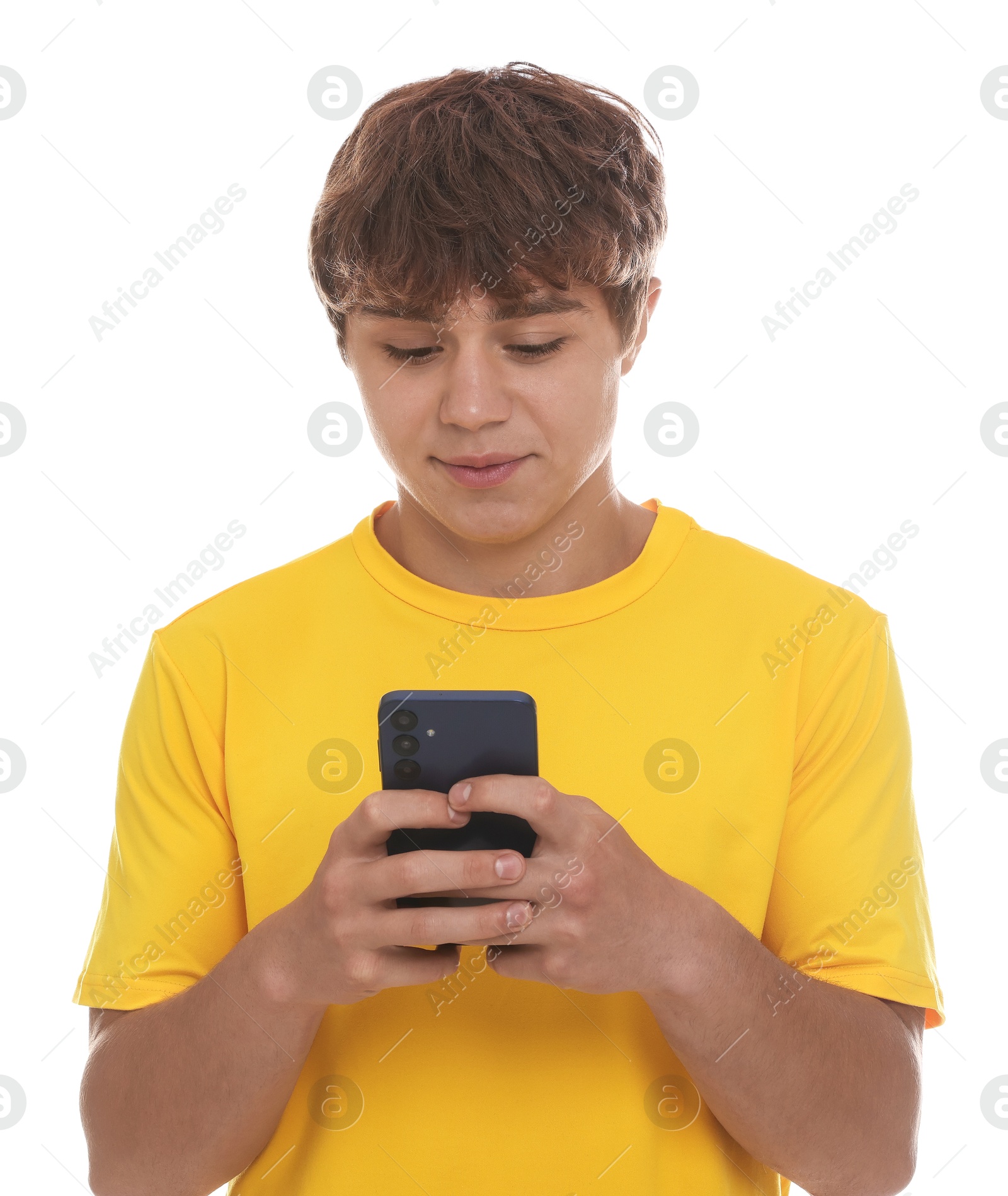Teenage boy using smartphone on white background Photo of Teenage boy using smartphone on white background