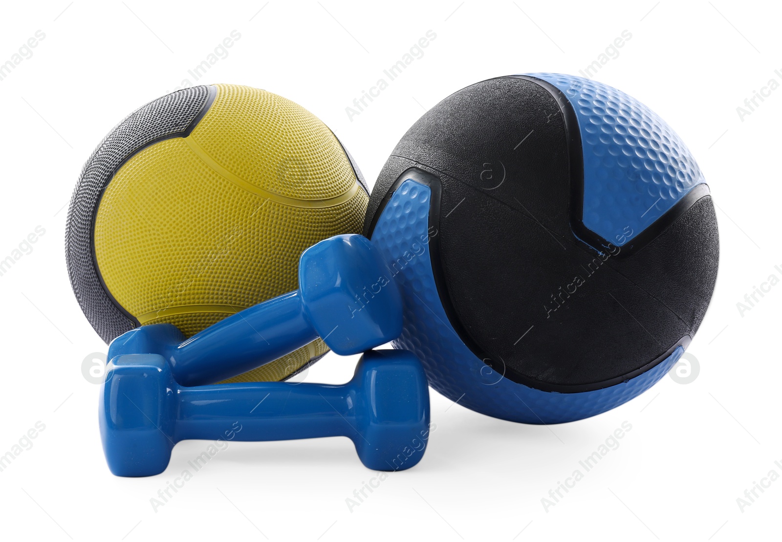 Photo of Medicine balls and dumbbells isolated on white