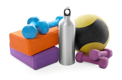 Photo of Medicine ball, dumbbells, foam blocks and water bottle isolated on white