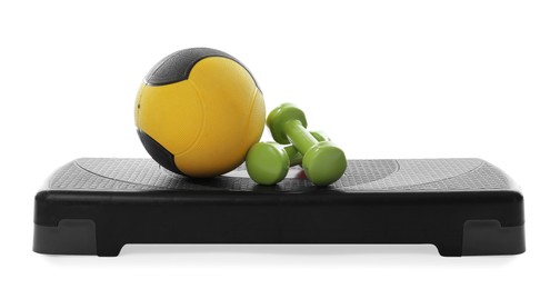 Photo of Medicine ball, dumbbells and step platform isolated on white