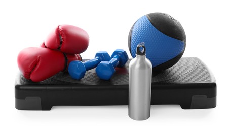 Photo of Medicine ball, dumbbells, boxing gloves, water bottle and step platform isolated on white