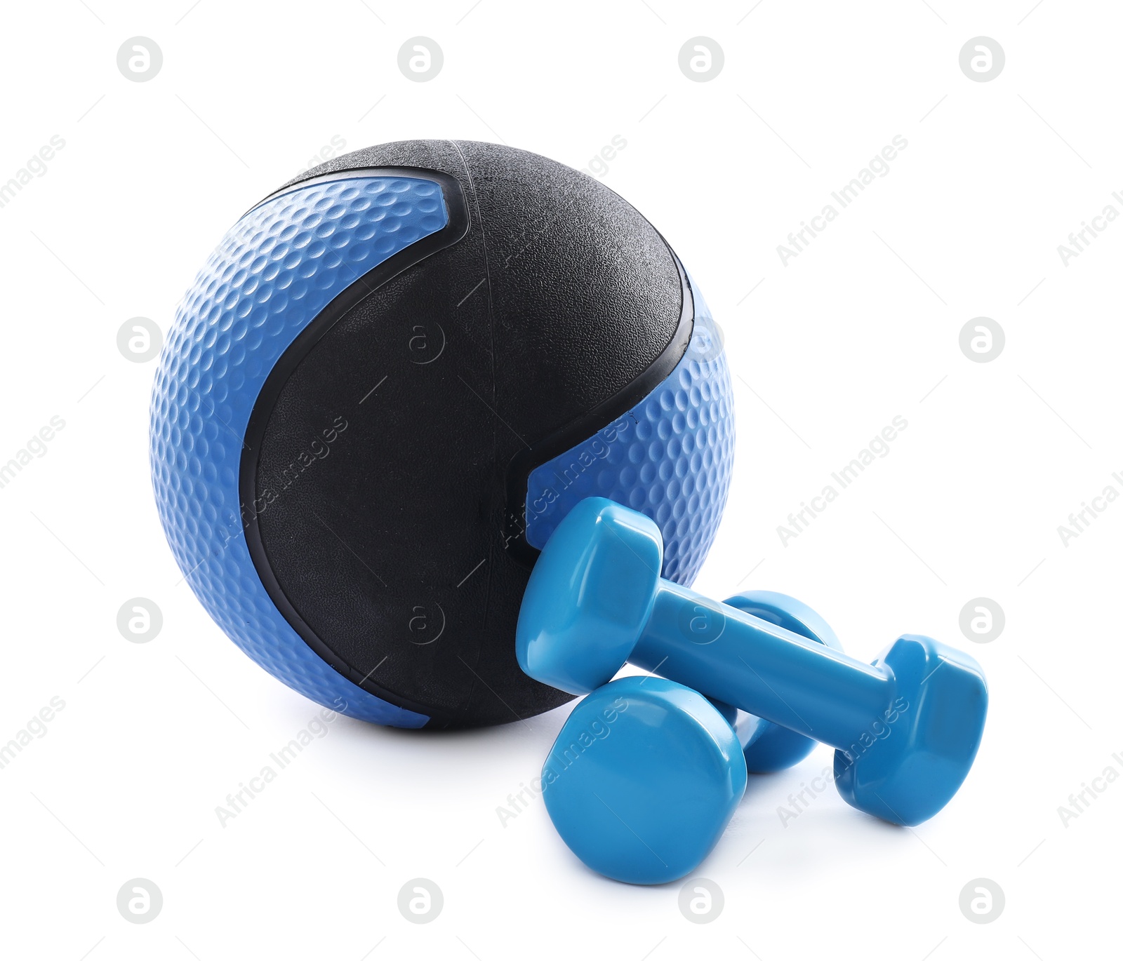 Medicine ball and dumbbells isolated on white Photo of Medicine ball and dumbbells isolated on white