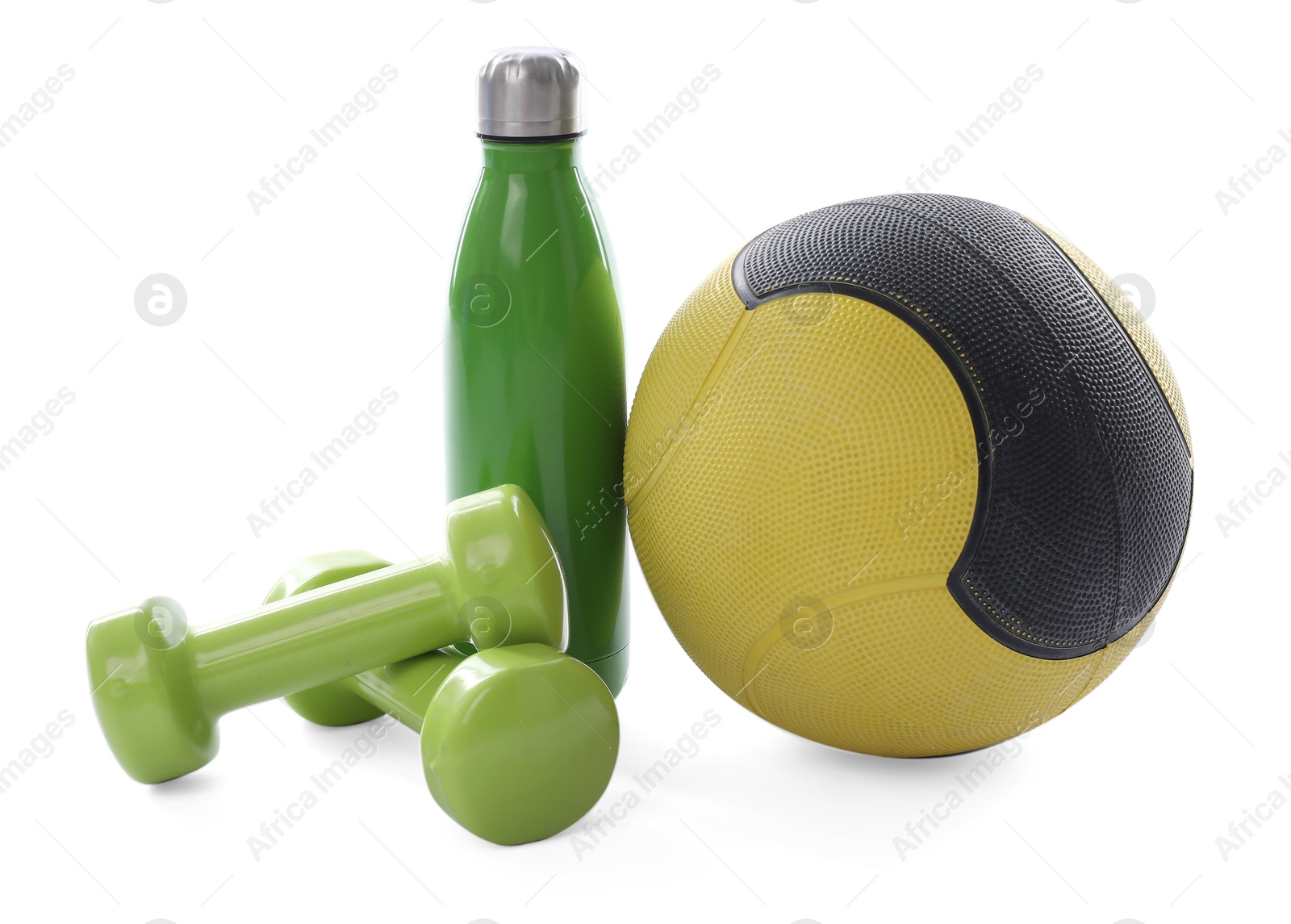 Medicine ball, dumbbells and water bottle isolated on white Photo of Medicine ball, dumbbells and water bottle isolated on white