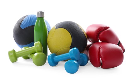 Photo of Medicine balls, dumbbells, boxing gloves and water bottle isolated on white