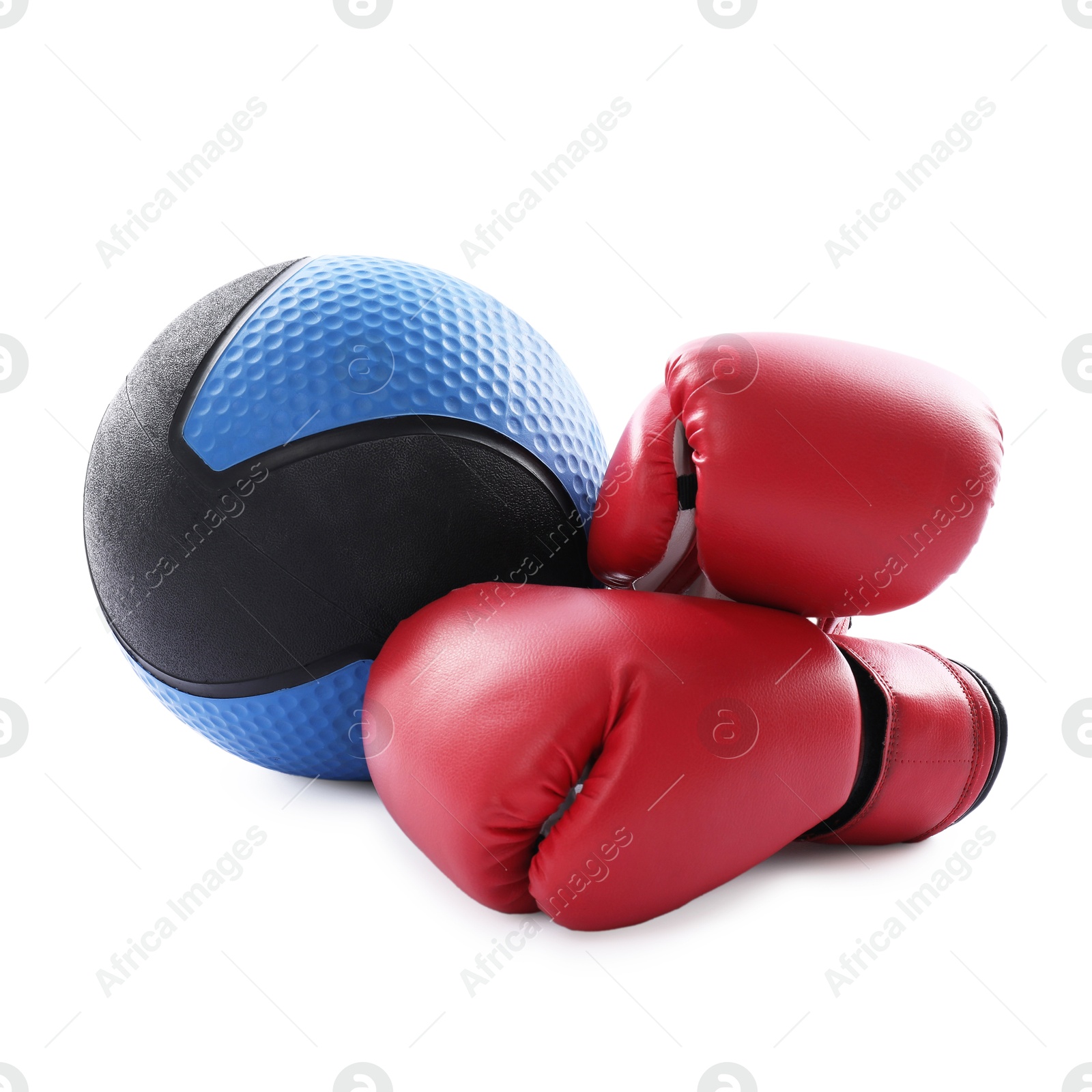 Photo of Medicine ball and boxing gloves isolated on white