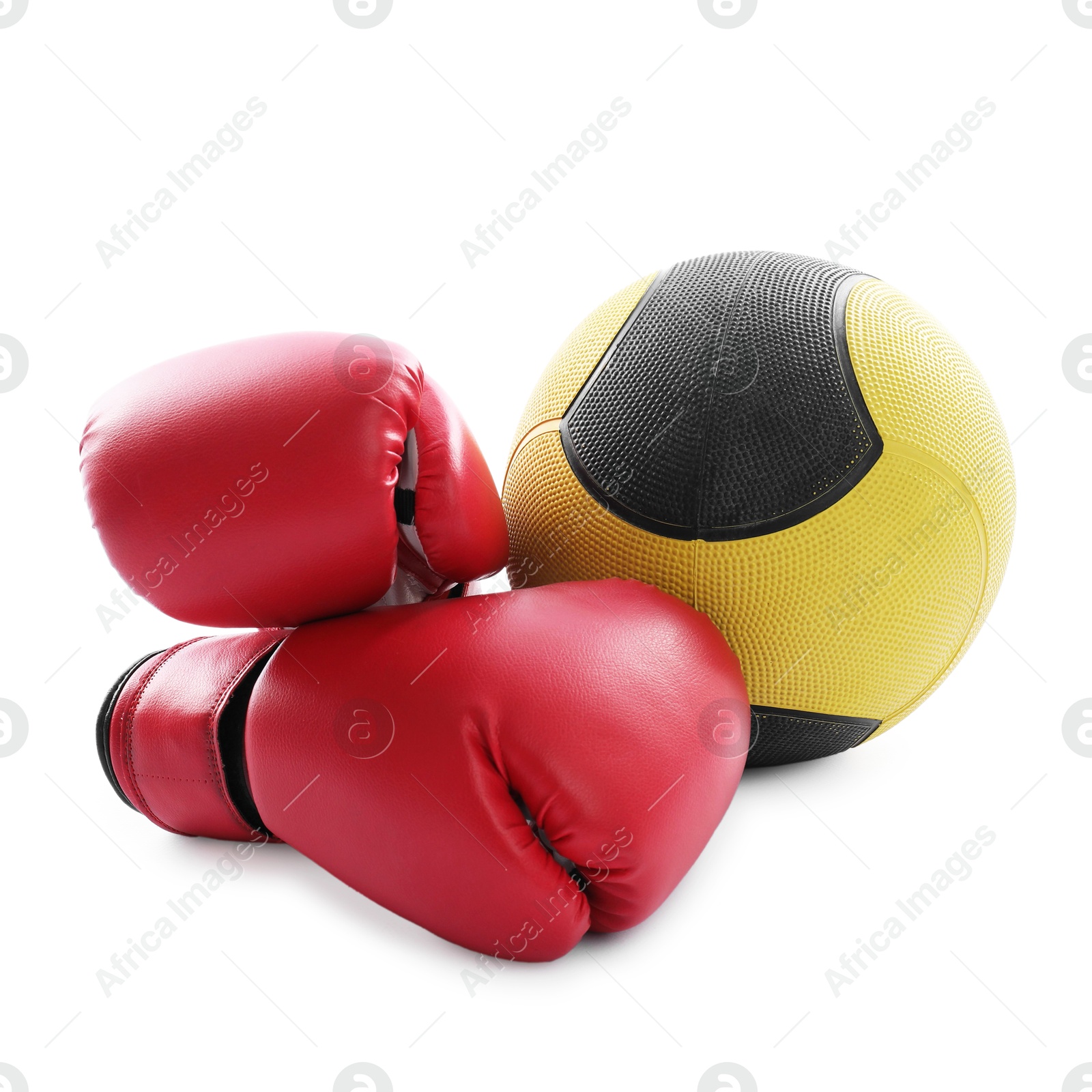 Photo of Medicine ball and boxing gloves isolated on white