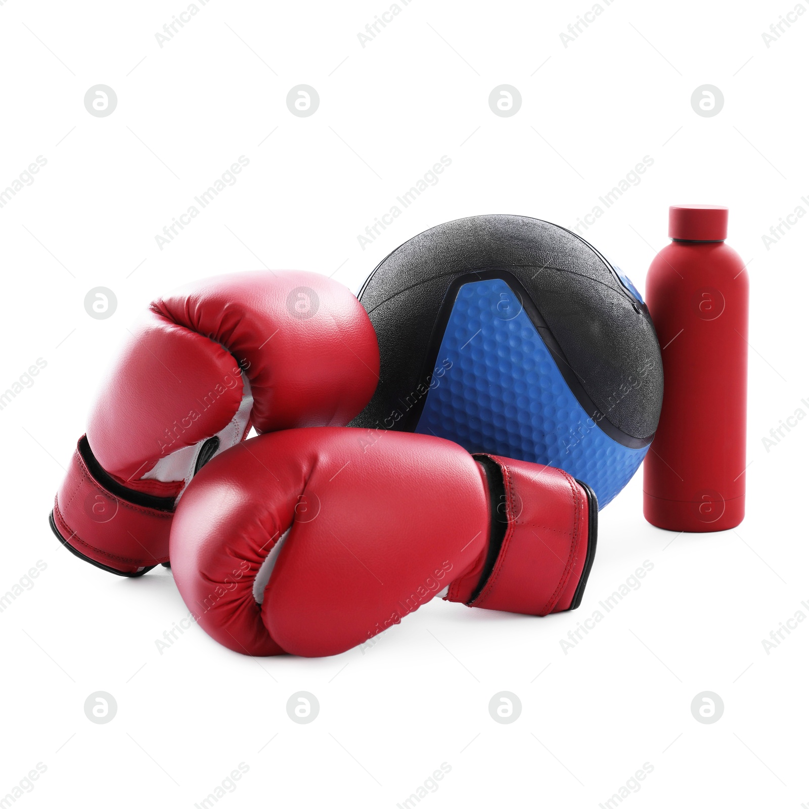 Medicine ball, water bottle and boxing gloves isolated on white Photo of Medicine ball, water bottle and boxing gloves isolated on white