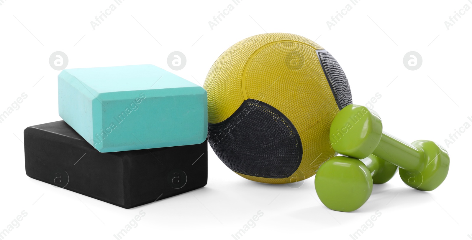 Medicine ball, dumbbells and foam blocks isolated on white Photo of Medicine ball, dumbbells and foam blocks isolated on white