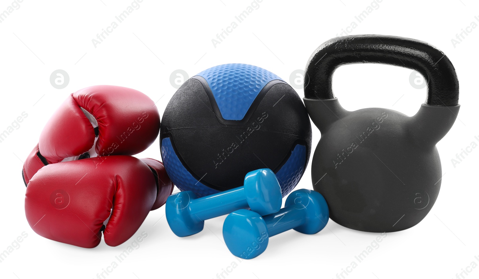 Photo of Medicine ball, kettlebell, dumbbells and boxing gloves isolated on white