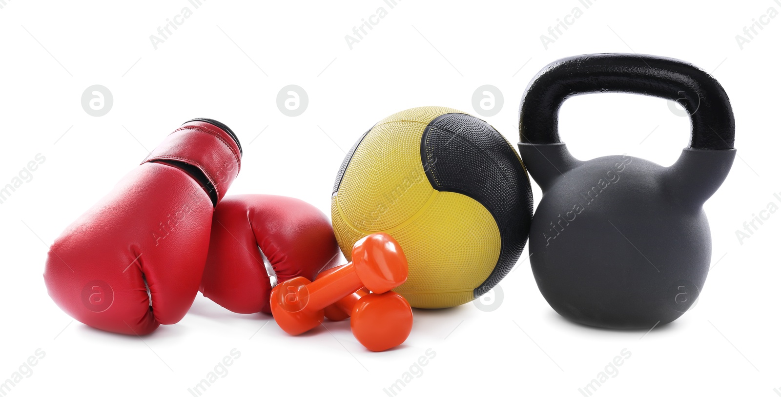 Medicine ball, kettlebell, dumbbells and boxing gloves isolated on white Photo of Medicine ball, kettlebell, dumbbells and boxing gloves isolated on white