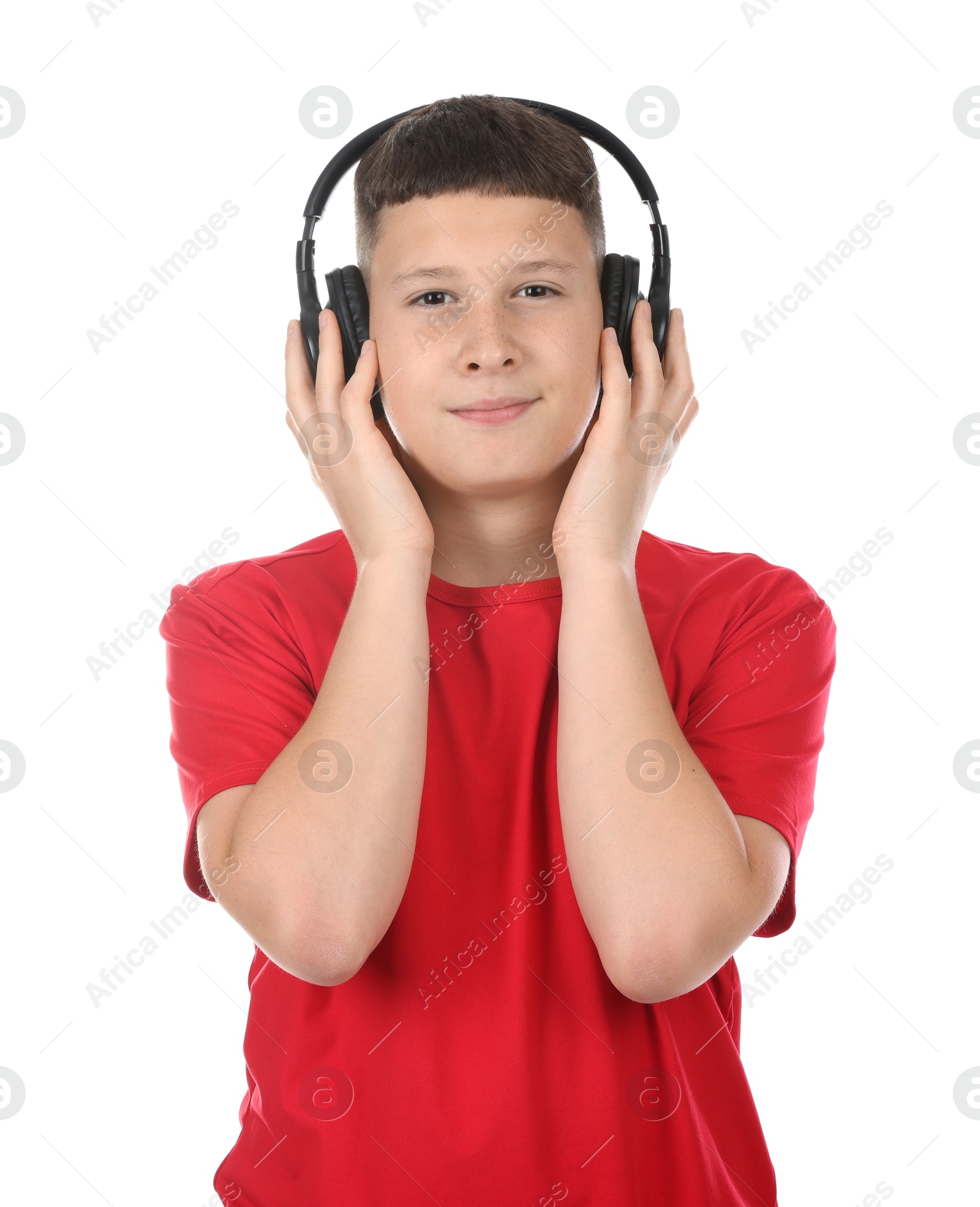 Teenage boy in headphones on white background Photo of Teenage boy in headphones on white background