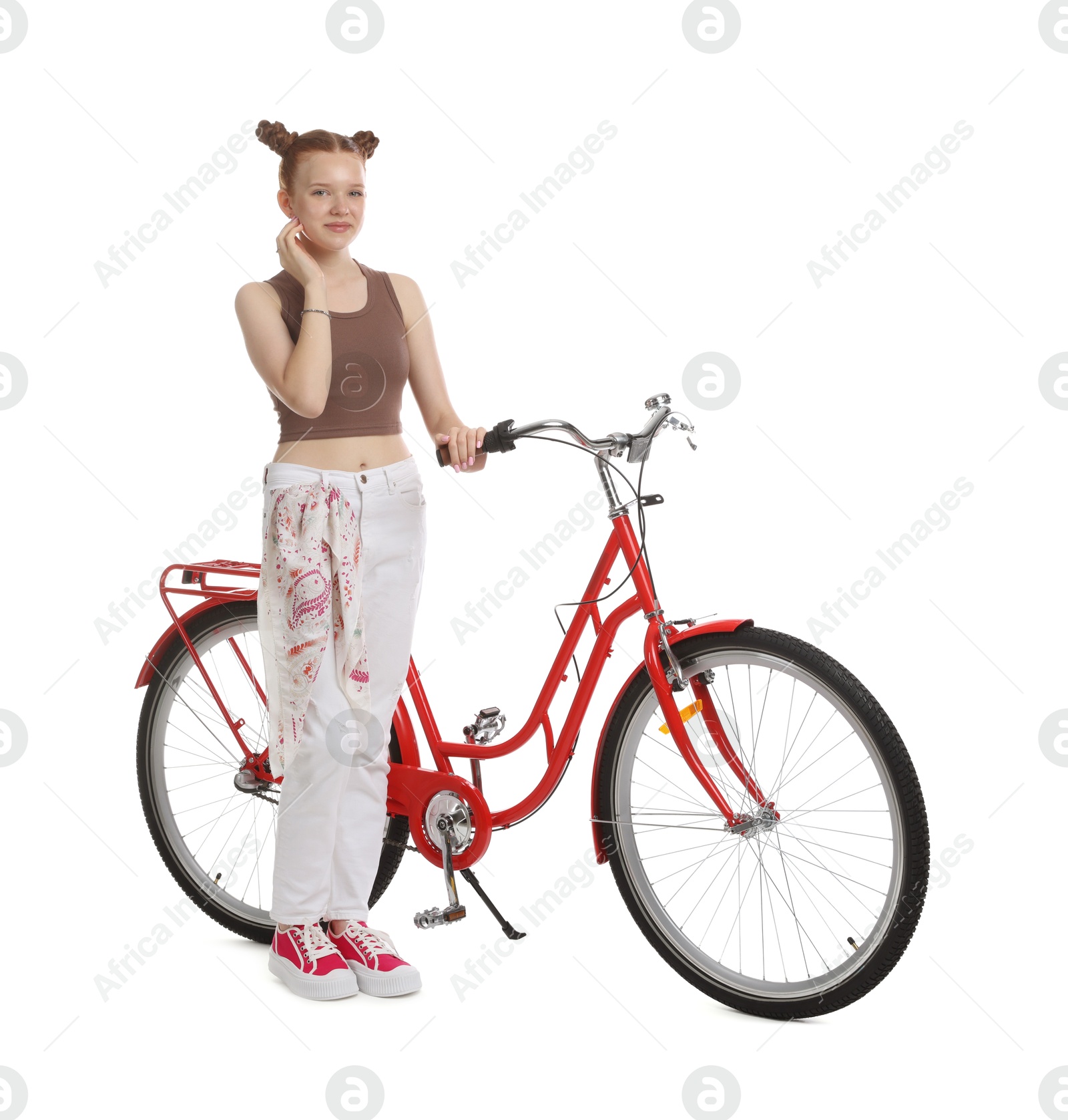 Teenage girl with red bicycle on white background Photo of Teenage girl with red bicycle on white background