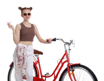 Photo of Teenage girl with red bicycle on white background