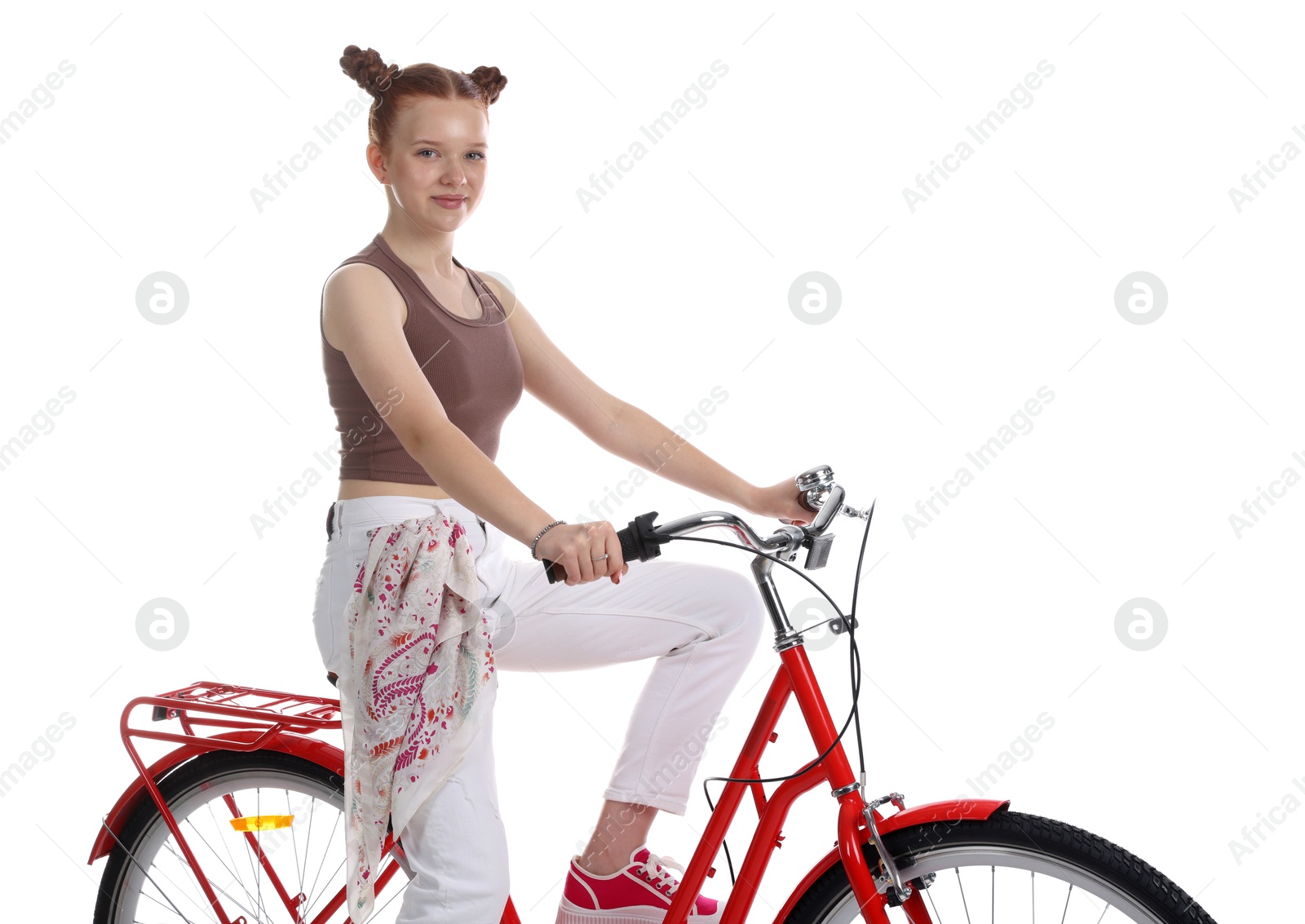 Photo of Teenage girl riding bicycle on white background