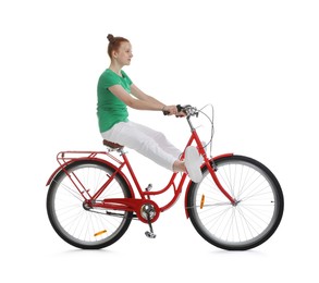 Photo of Teenage girl riding bicycle on white background