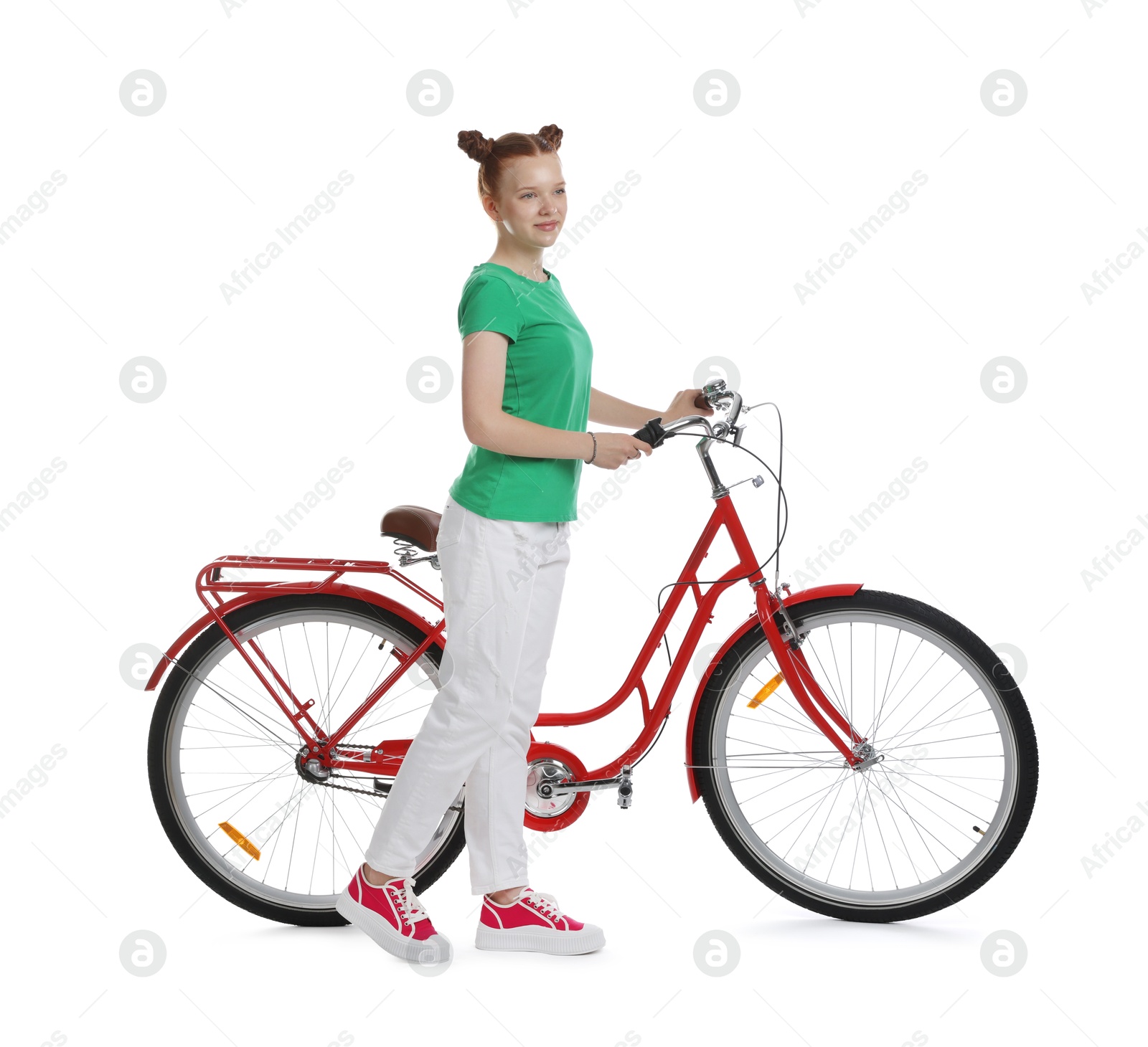 Teenage girl with red bicycle on white background Photo of Teenage girl with red bicycle on white background