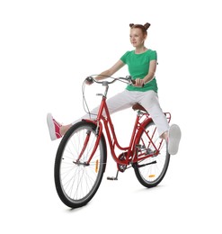 Photo of Teenage girl riding bicycle on white background