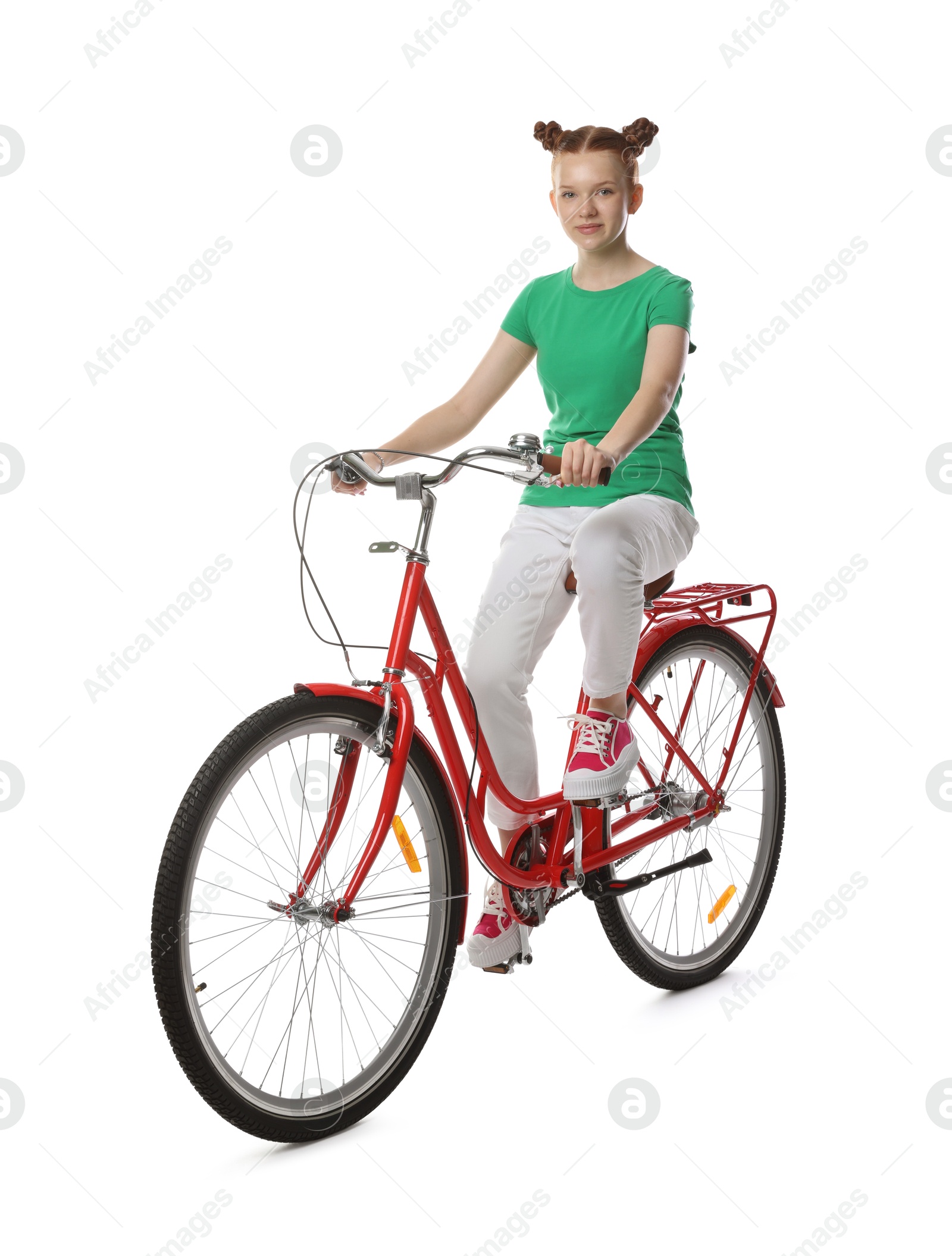 Photo of Teenage girl riding bicycle on white background