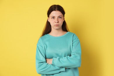 Photo of Portrait of teenage girl on yellow background