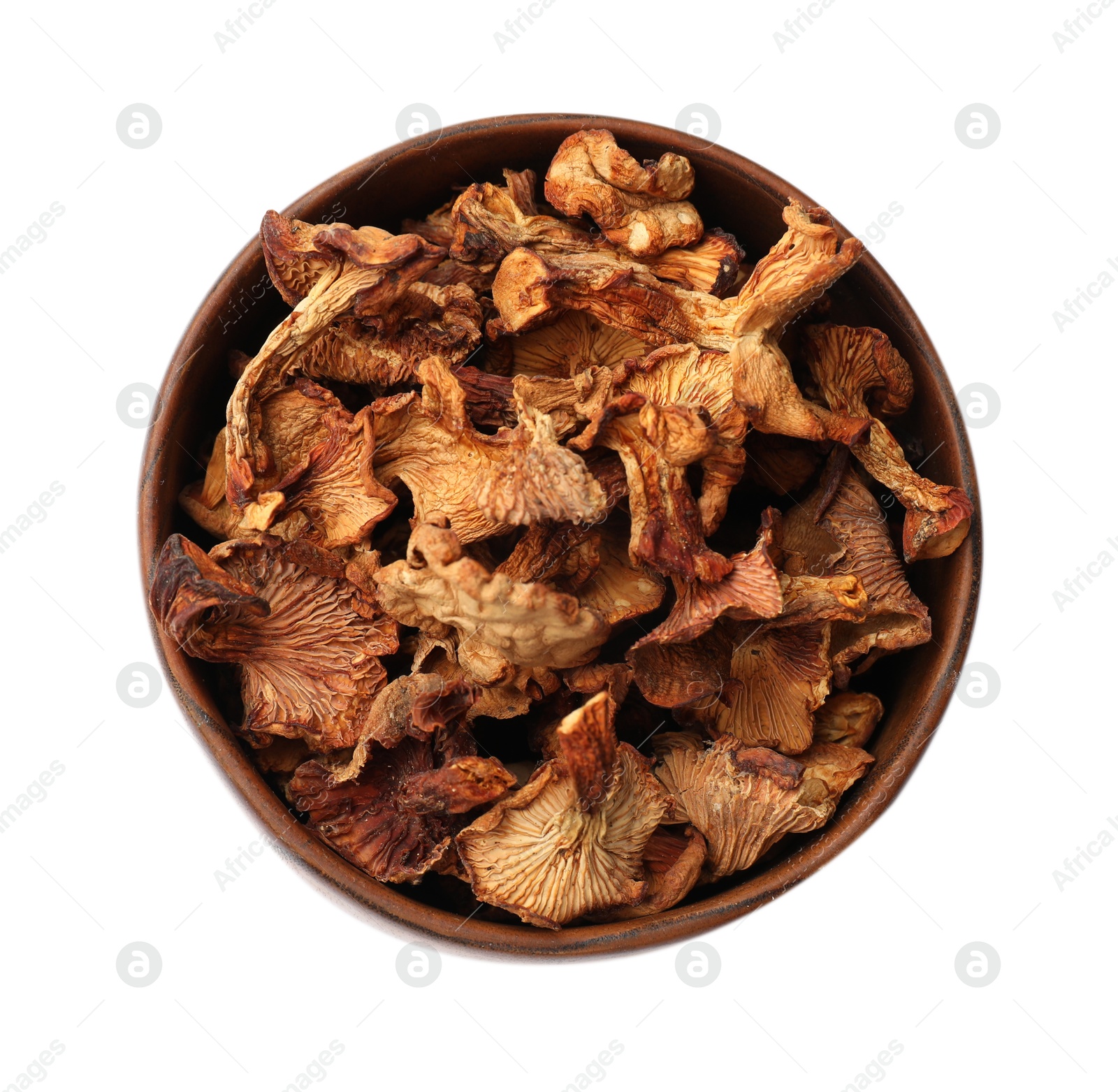 Photo of Dried chanterelle mushrooms in bowl isolated on white, top view