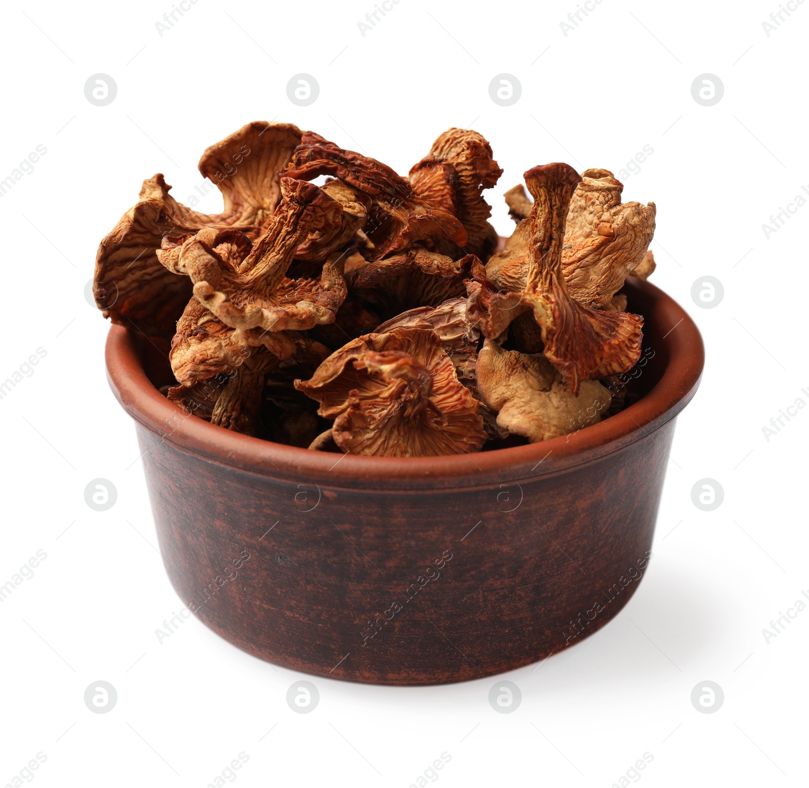 Photo of Dried chanterelle mushrooms in bowl isolated on white