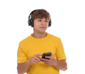 Photo of Teenage boy in headphones with smartphone on white background