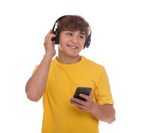Photo of Smiling teenage boy in headphones with smartphone on white background
