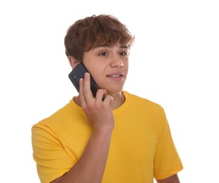 Photo of Smiling teenage boy talking by smartphone on white background
