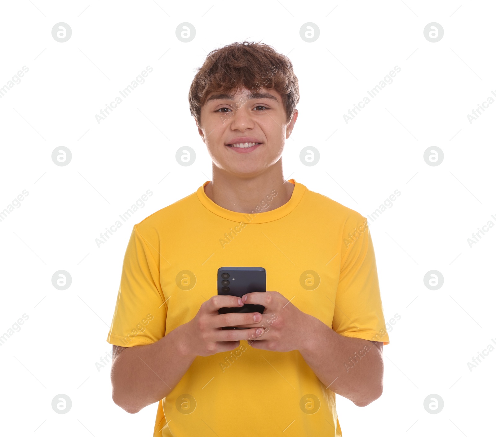 Smiling teenage boy with smartphone on white background Photo of Smiling teenage boy with smartphone on white background