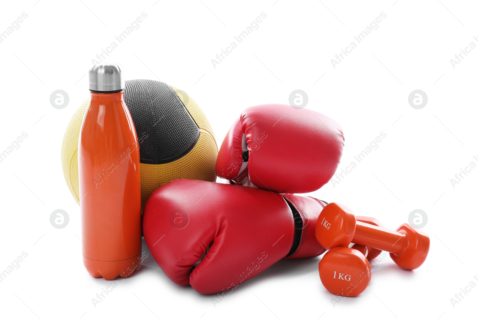 Medicine ball, dumbbells, water bottle and boxing gloves isolated on white Photo of Medicine ball, dumbbells, water bottle and boxing gloves isolated on white