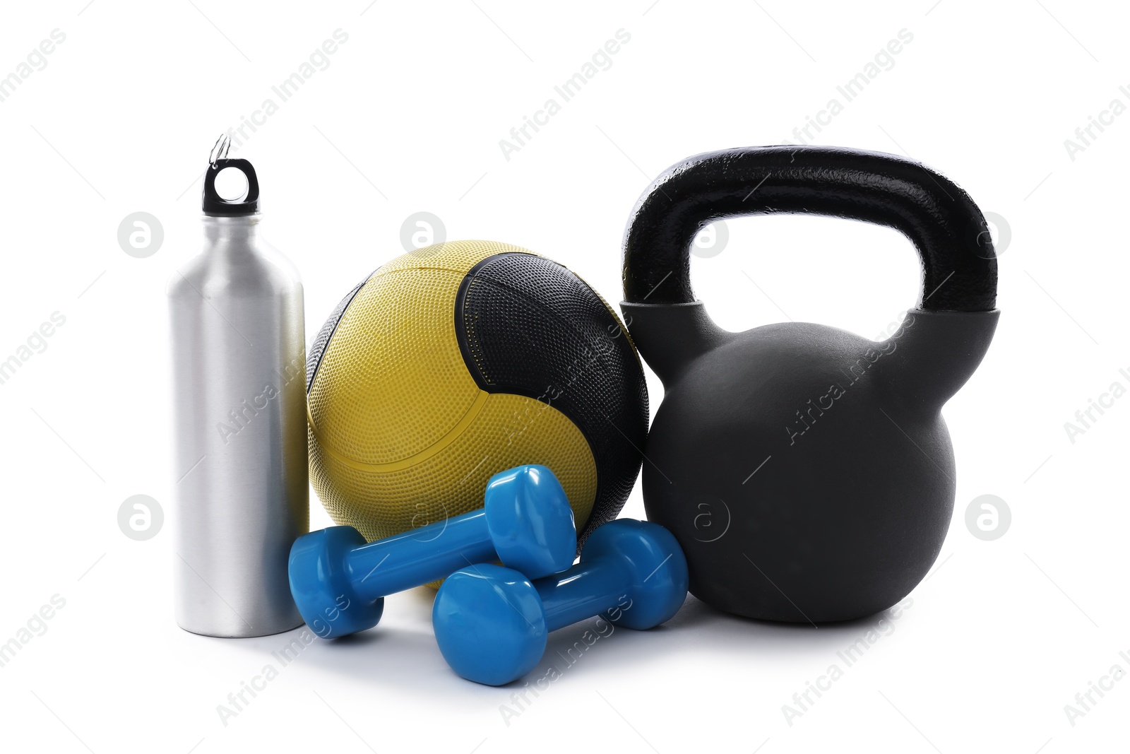 Medicine ball, kettlebell, dumbbells and water bottle isolated on white Photo of Medicine ball, kettlebell, dumbbells and water bottle isolated on white