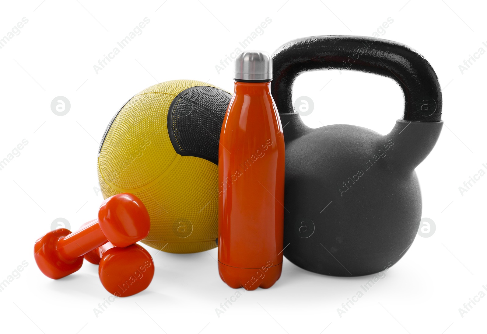 Medicine ball, kettlebell, dumbbells and water bottle isolated on white Photo of Medicine ball, kettlebell, dumbbells and water bottle isolated on white