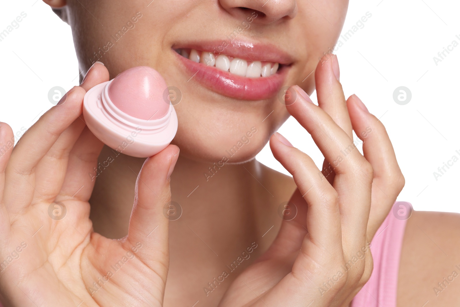 Young woman with lip balm on white background, closeup Photo of Young woman with lip balm on white background, closeup