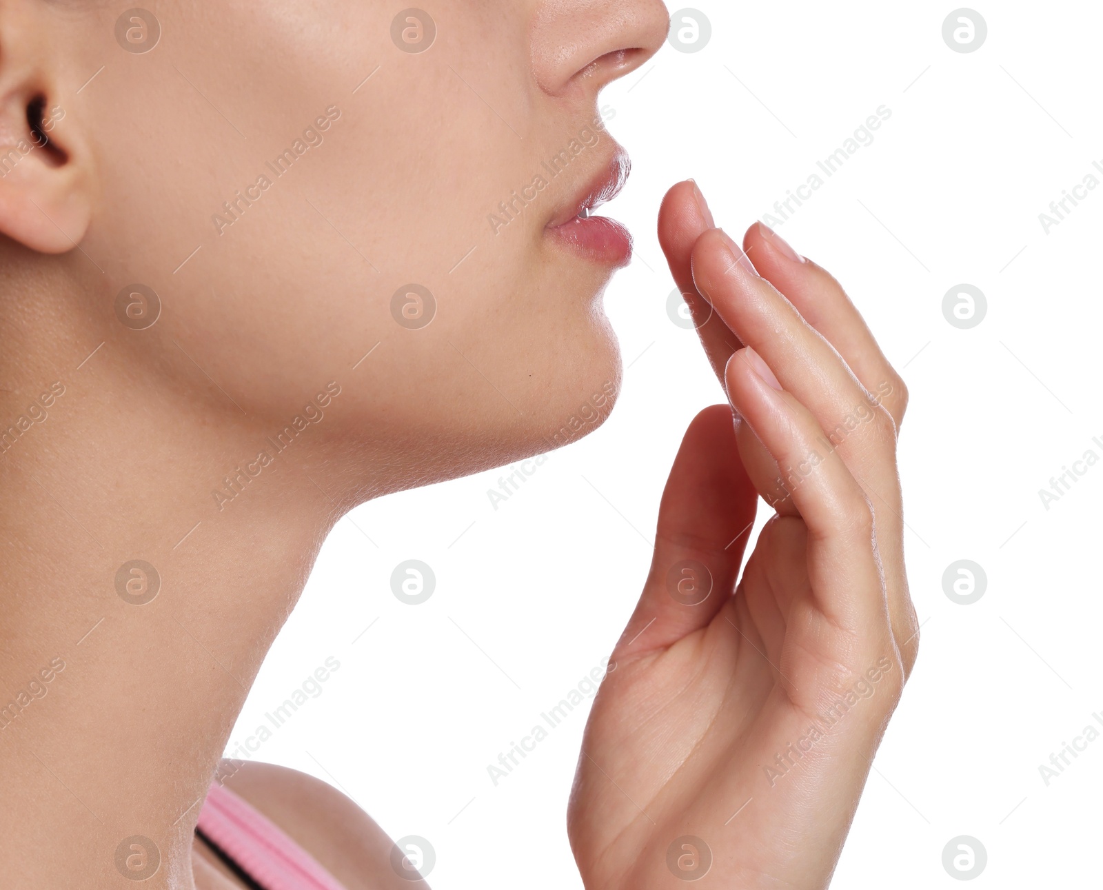 Young woman with lip balm on her lips against white background, closeup Photo of Young woman with lip balm on her lips against white background, closeup