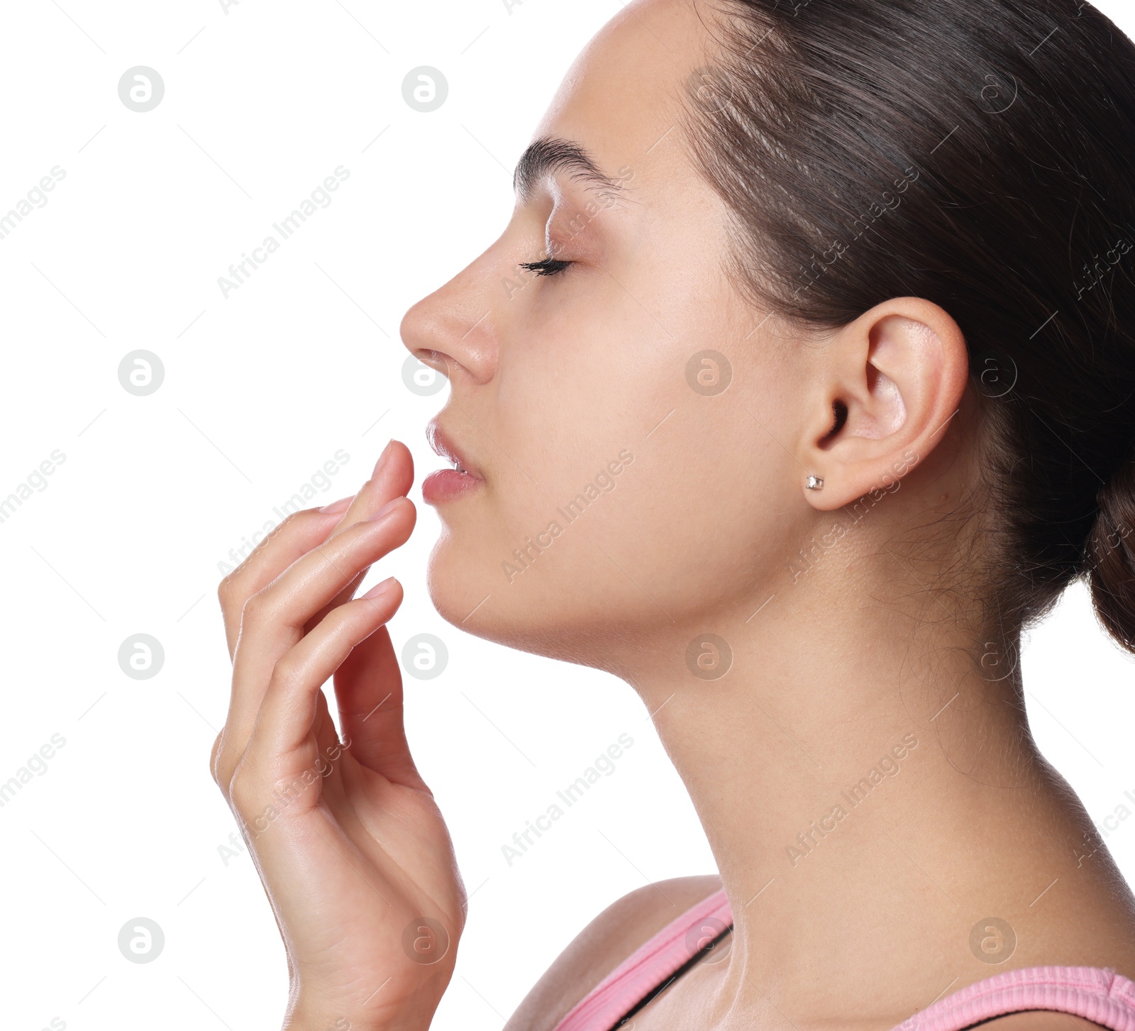 Young woman with lip balm on her lips against white background Photo of Young woman with lip balm on her lips against white background