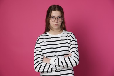 Photo of Teenage girl in glasses on crimson background