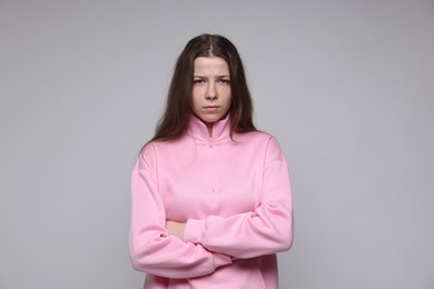 Photo of Portrait of teenage girl on light grey background