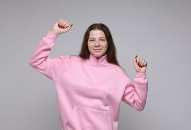 Photo of Portrait of teenage girl on light grey background