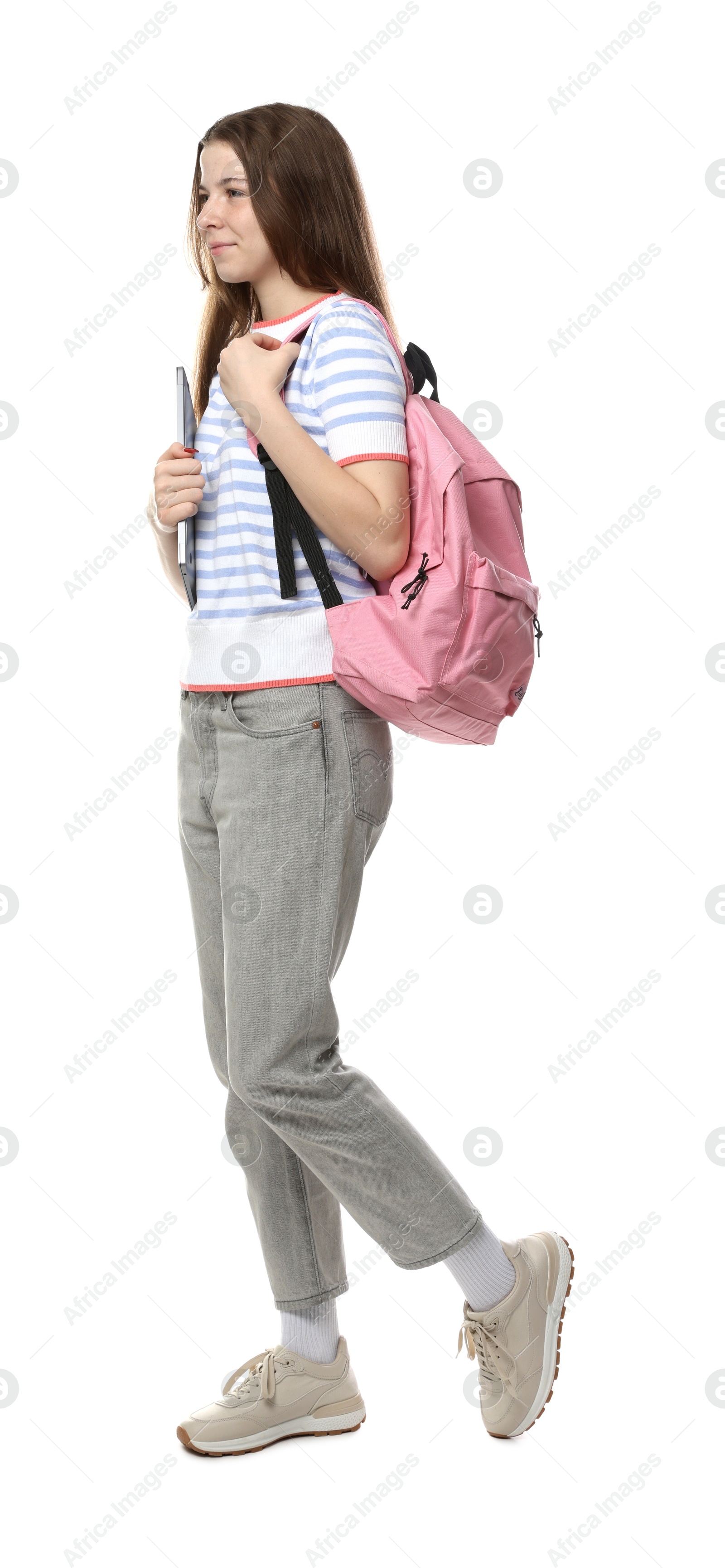 Teenage girl with laptop and backpack on white background Photo of Teenage girl with laptop and backpack on white background