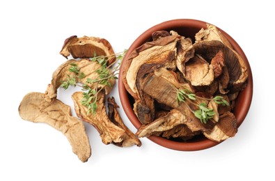 Photo of Pieces of dried mushrooms and rosemary in bowl isolated on white, top view