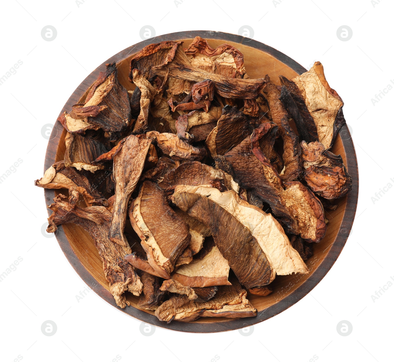 Pieces of dried mushrooms in bowl isolated on white, top view Photo of Pieces of dried mushrooms in bowl isolated on white, top view