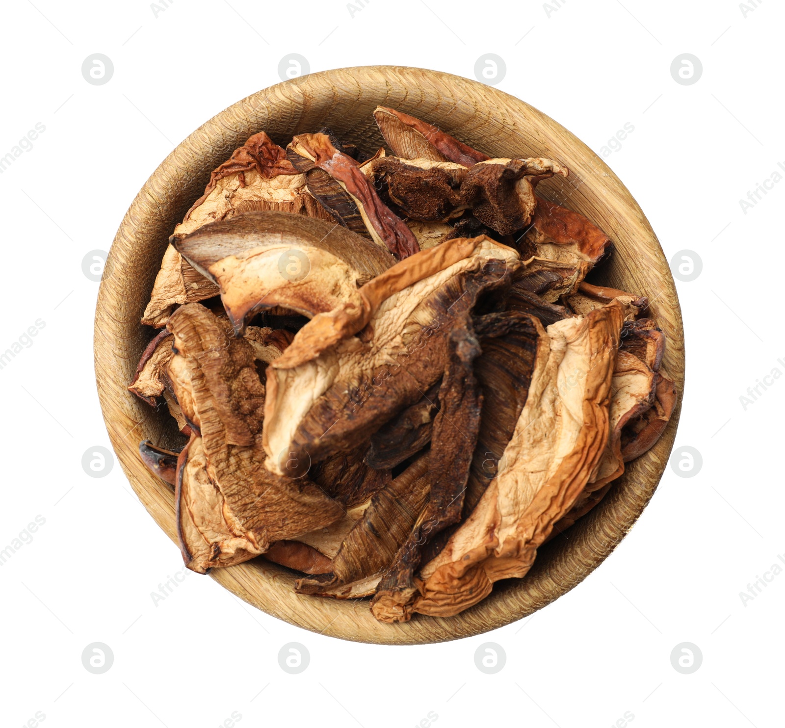 Pieces of dried mushrooms in bowl isolated on white, top view Photo of Pieces of dried mushrooms in bowl isolated on white, top view
