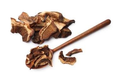Photo of Pieces of dried mushrooms and spoon isolated on white, top view